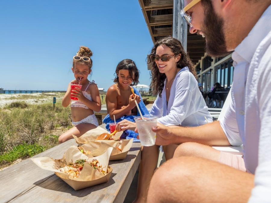 family dining at dragonfly poolside restaurant at the lodge in gulf shores